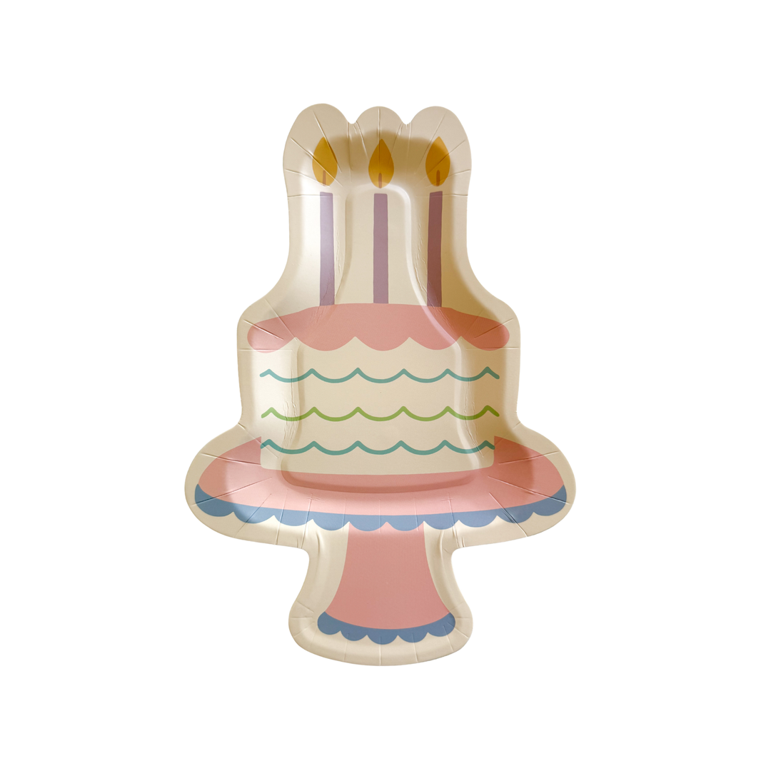 Birthday cake shaped paper party plate with pastel candles and colorful icing details